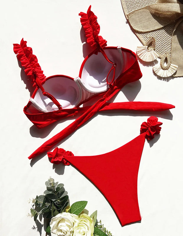 push-up bikini set with lace-up details and bow accents.