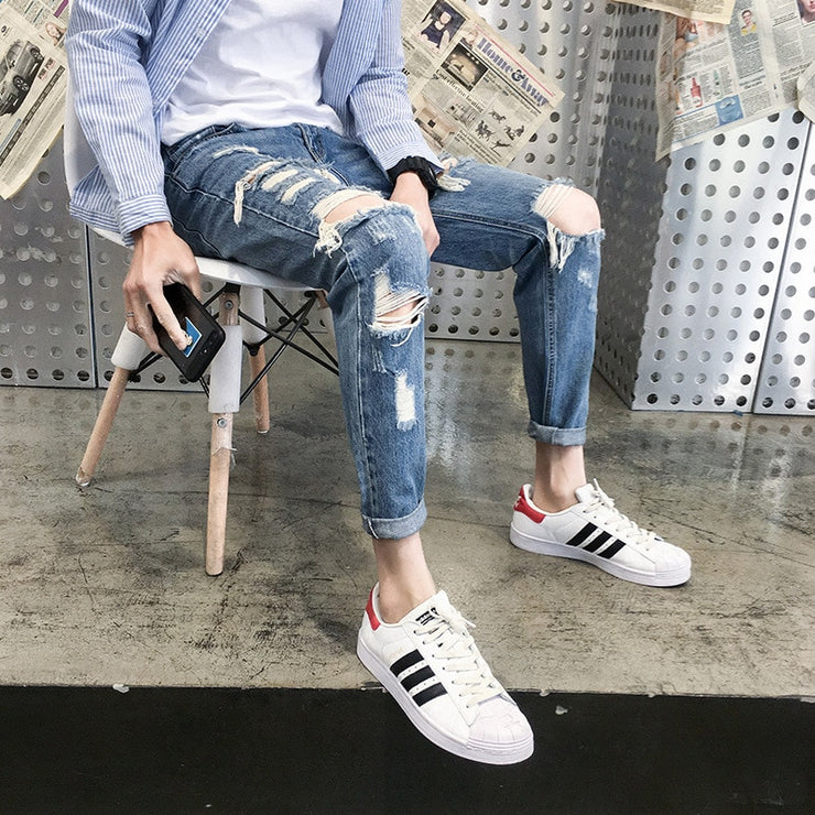 Top quality 2020 Distressed beggar jeans male giant ripped hole handsome male feet hip hop streetweat cowboy harem pants men